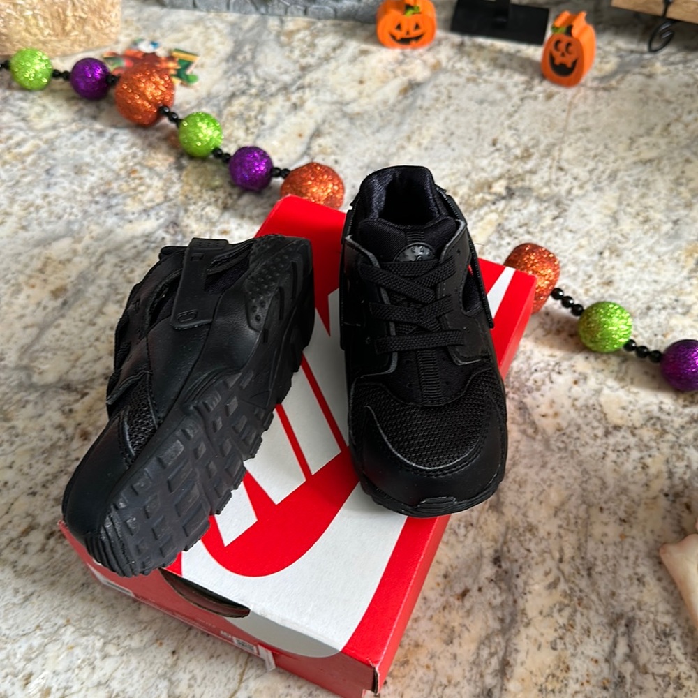 Black Nike Huarache shoes. Get them while you can.